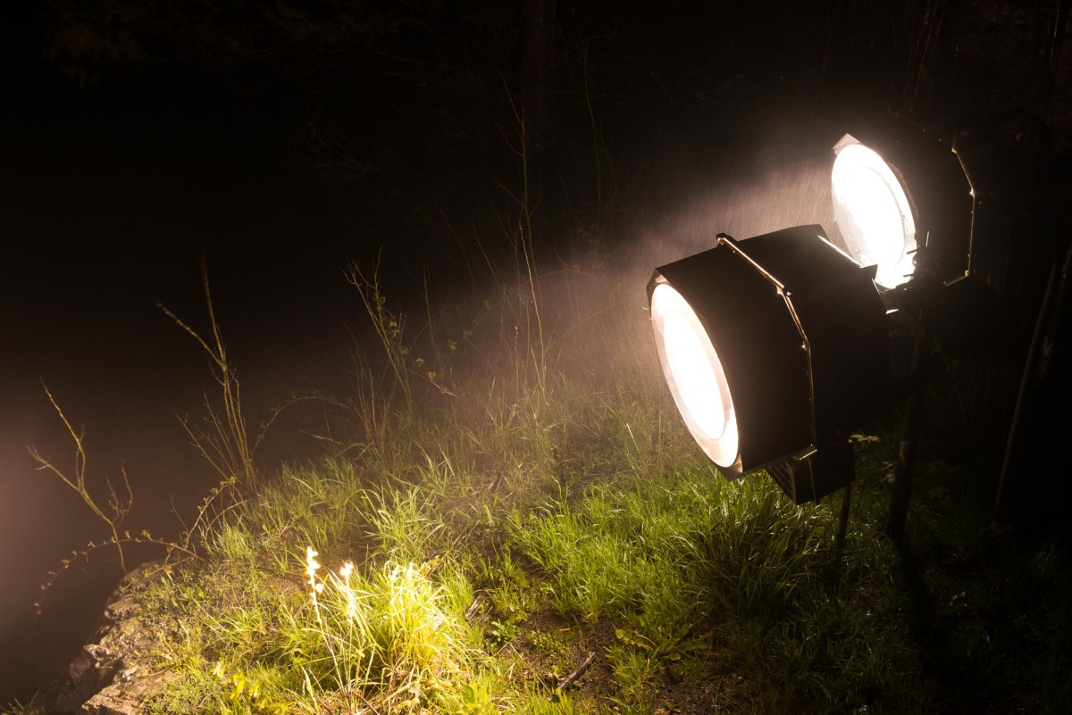 Spotlights that illuminate Snoqualmie Falls at night.