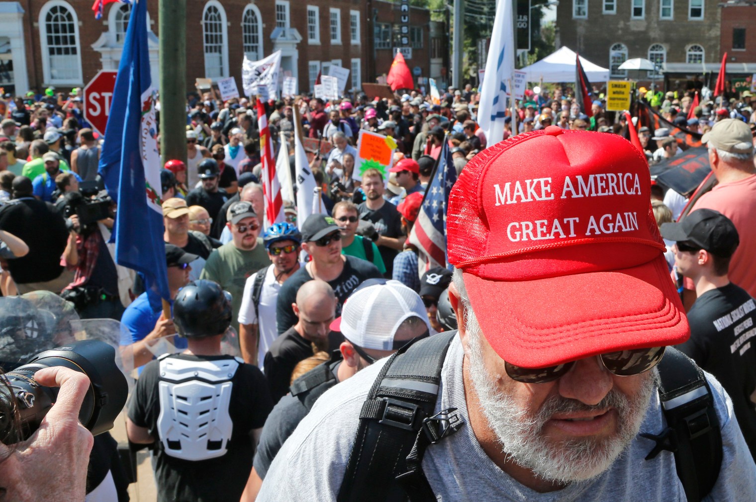 A white nationalist demonstrator walks into Lee Park in Charlottesville, Va., on Aug. 12, 2017. Hundreds of people chanted, threw punches, hurled water bottles and unleashed chemical sprays on each other on Saturday after violence erupted at a white nationalist rally.