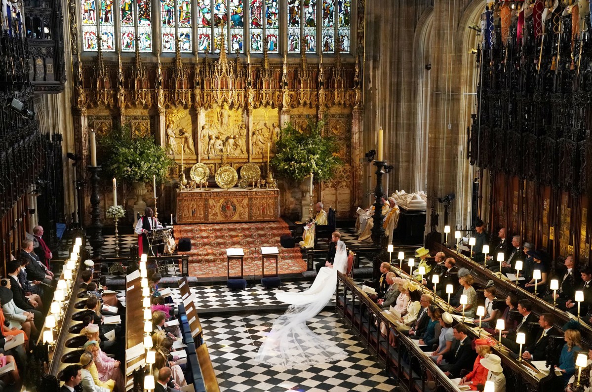 Prince Harry and Meghan Markle listen to an address by the Most Rev. Bishop Michael Curry, presiding bishop of the American Episcopal Church, in St George's Chapel at Windsor Castle, May 19, 2018.