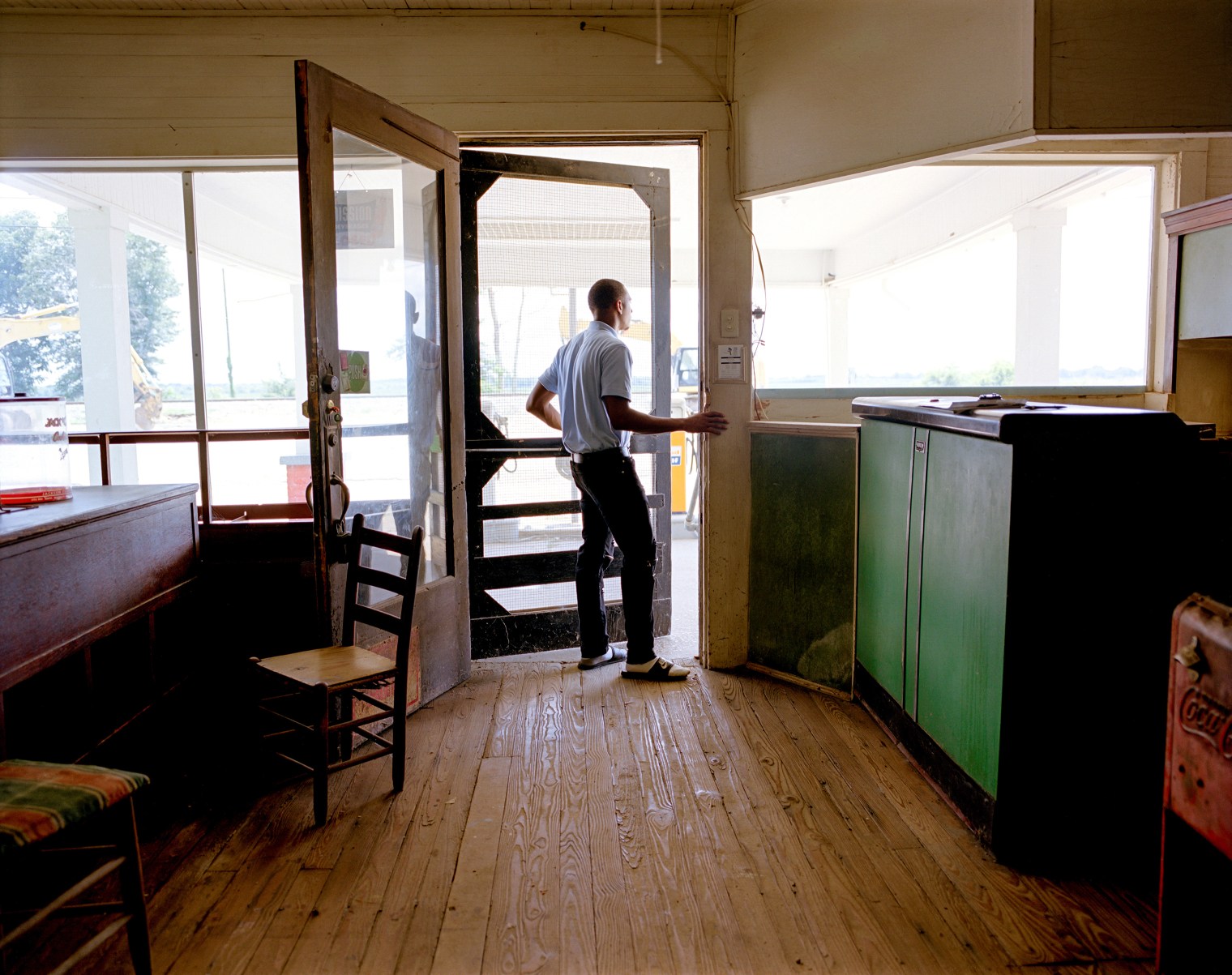 Rodkevian Thomas, an intern with the Emmett Till Interpretive Center, visits the restored service station adjacent to the dilapidated Bryant's Grocery in Money, Miss. On August 24, 1955, 14-year-old Emmett Till was visiting Bryantâ€™s Grocery when he was accused of violating the racial customs of the time by whistling at a white woman. He was then kidnapped, beaten and, on Aug. 28, lynched.