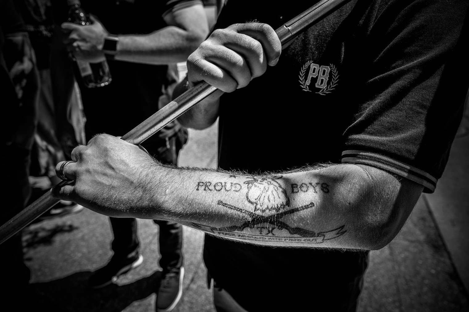 A man with a 'Proud Boys' tattoo attends the '2nd amendment Come and Take It' rally outside the NRA Convention in Dallas, on May 5, 2018.