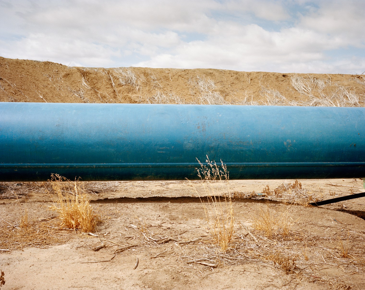 A pipe used to irrigate cotton on Braemar Property, part of Haddon Rig Station, in New South Wales in December. Drought has prevented dry-cropping, limited access to irrigation water and reduced feed for livestock, causing a significant decrease in profit.