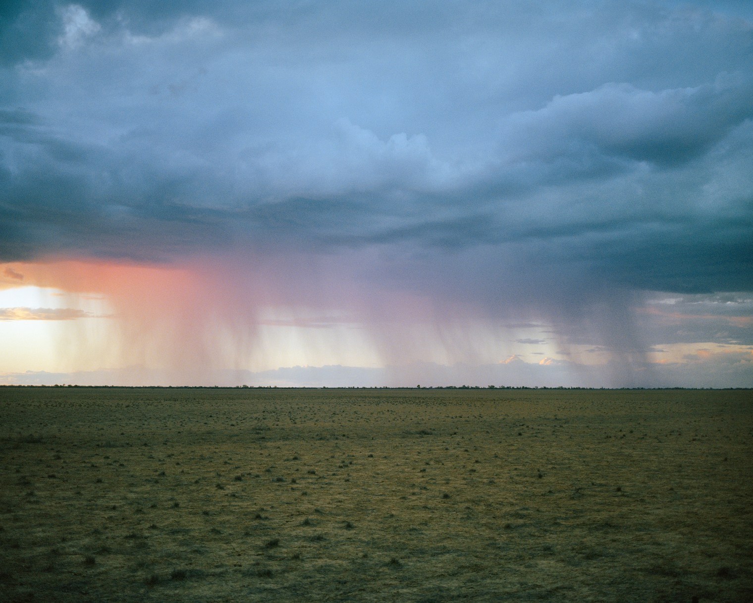 A storm moves across drought-affected land near Tuen, south of Cunnamulla, in Queensland in November.