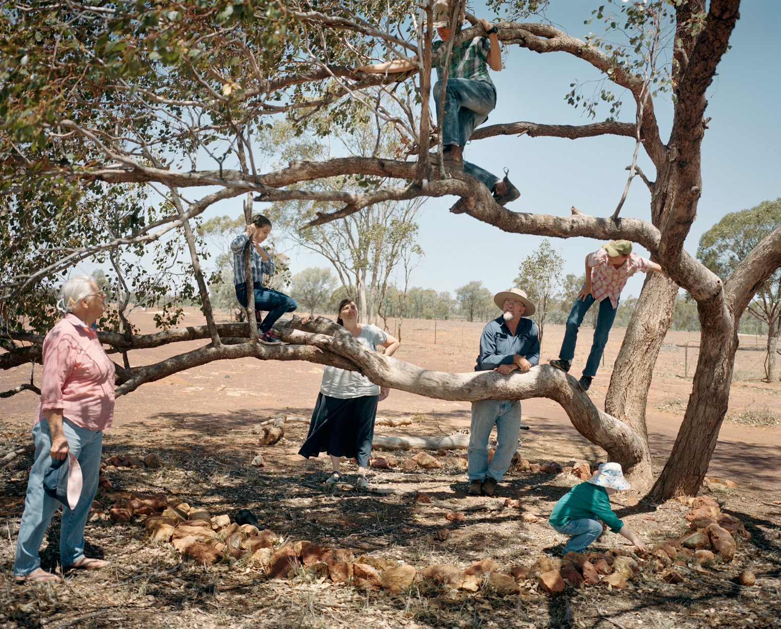 Farmers Kent Morris and Sam Cormack pose for a portrait with their children and Kent's mother at Kandimulla Property in November. Financial pressure brought on by the drought caused Morris to find off-farm income; he now works at the municipal council in Mitchell. Morris and Cormack live in Mitchell during the week and maintain the farm on the weekends.