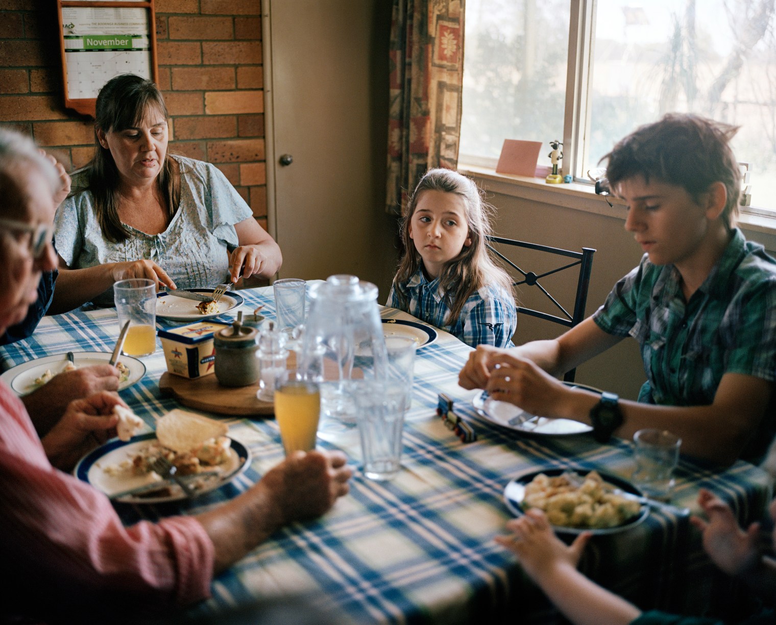 Farmers Kent Morris and Sam Cormack eat lunch with their children and his mother at Kandimulla Property in Queensland in November. Cormack has three children from a previous relationship—Grace, 9; Frank, 14; and Nicholas, 12—and a son, Luke, 3, with Morris.