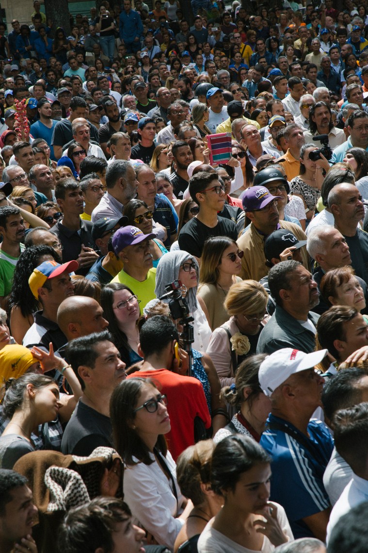 A crowd gathers to listen to opposition leader Juan GuaidÃ³ during a news conference on Jan. 25, 2019.