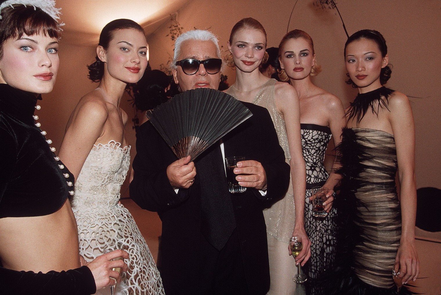 Karl Lagerfeld poses with models