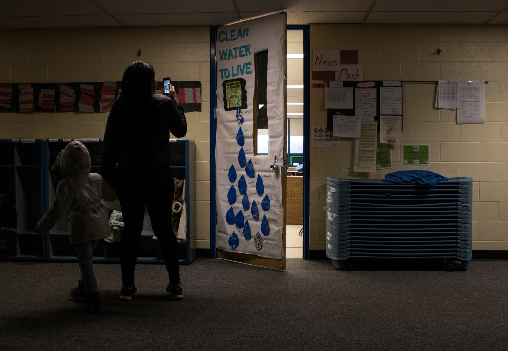 Hawk takes a picture of a classroom door at her children's Head Start program.