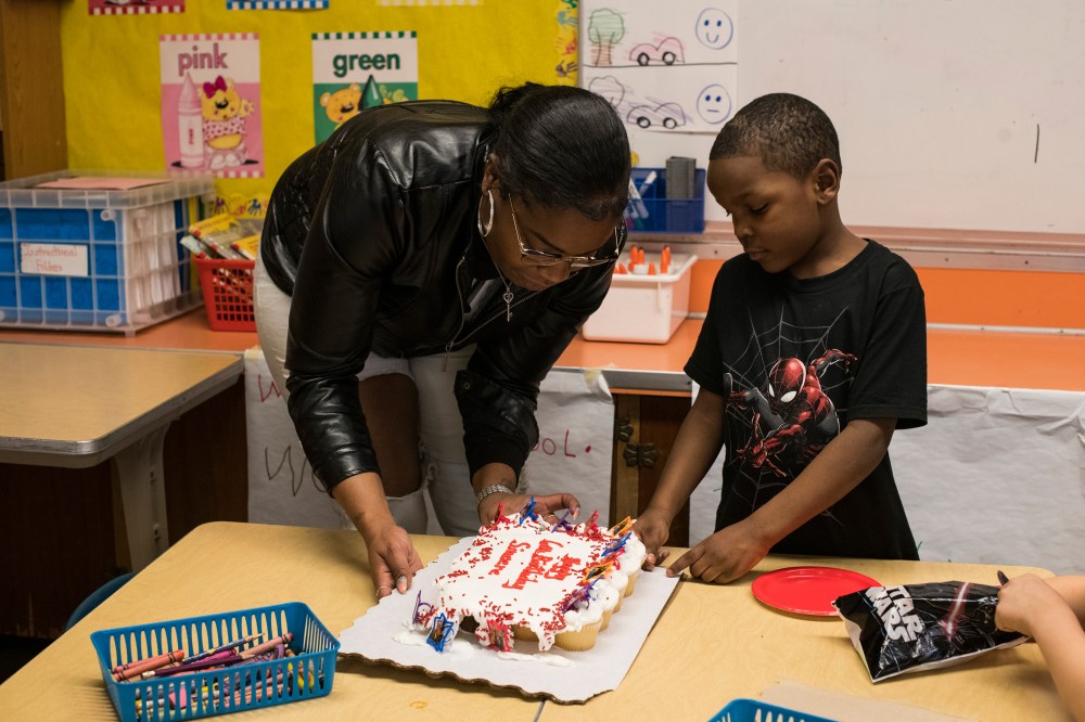 Sincere helps his mom distribute the Ninja Turtle cupcakes she brought him and his kindergarten classmates during snack time at his school in Flint, Mich., on Monday, February 4, 2019.