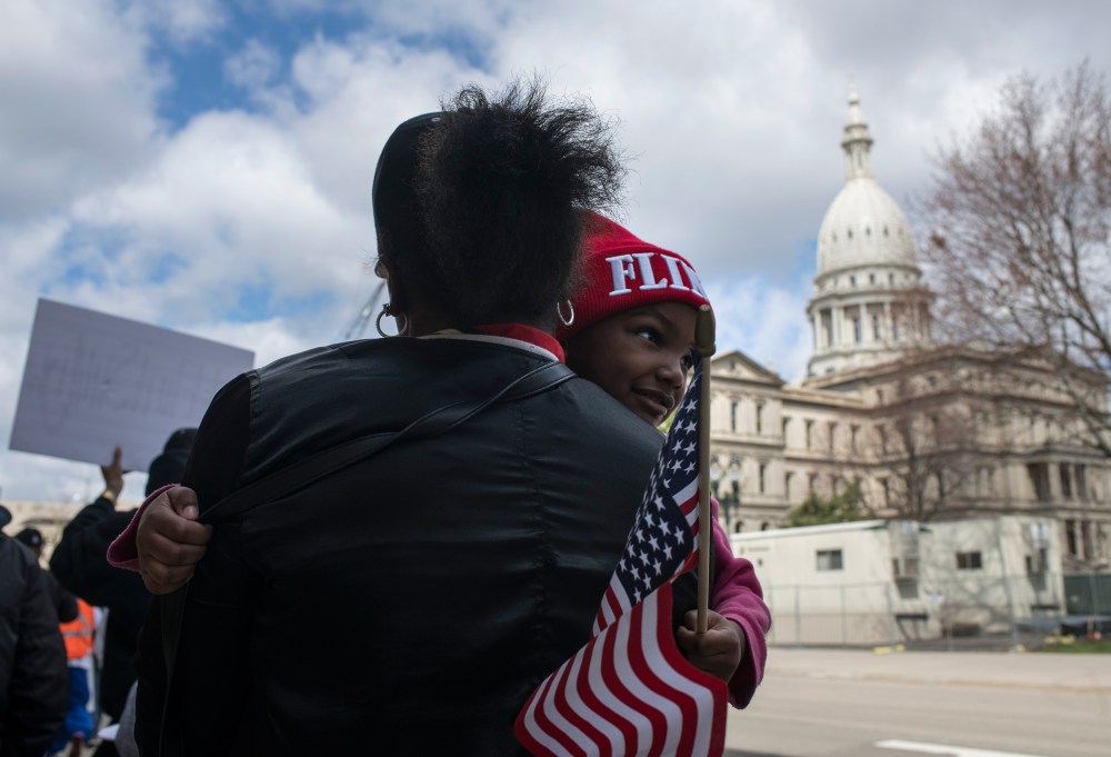 On the fourth anniversary of the water switch that caused the lead pollution, Hawk and daughter Aliana joined other Flint residents last year protesting at the Michigan state capitol.