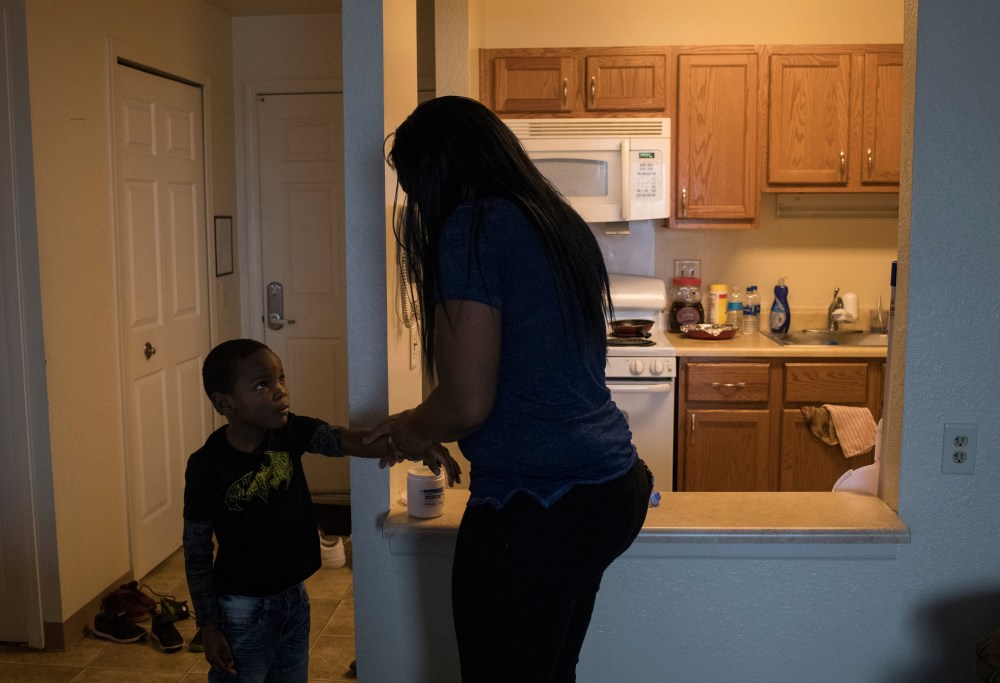 Ariana Hawk applies rash cream to her son Sincere at their home in Flint, Mich., on April 24, 2018