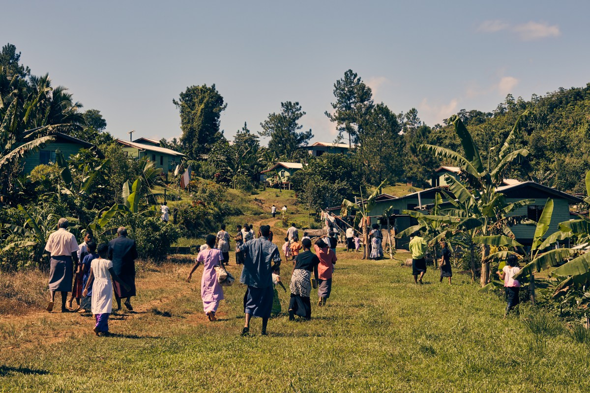 Villagers leave a Sunday church service in the town that was built to replace Vunidogoloa.