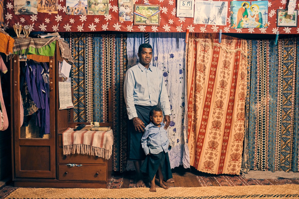 Apisai Logaivau and his son Simione Botu in their home in Vunidogoloa. Logaivau lives here with his wife and four other children.