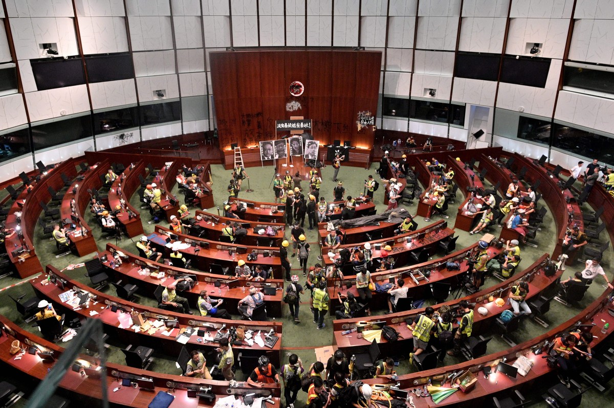 Protesters and members of the media are seen in the chambers after demonstrators broke into the government headquarters in Hong Kong on July 1, 2019.