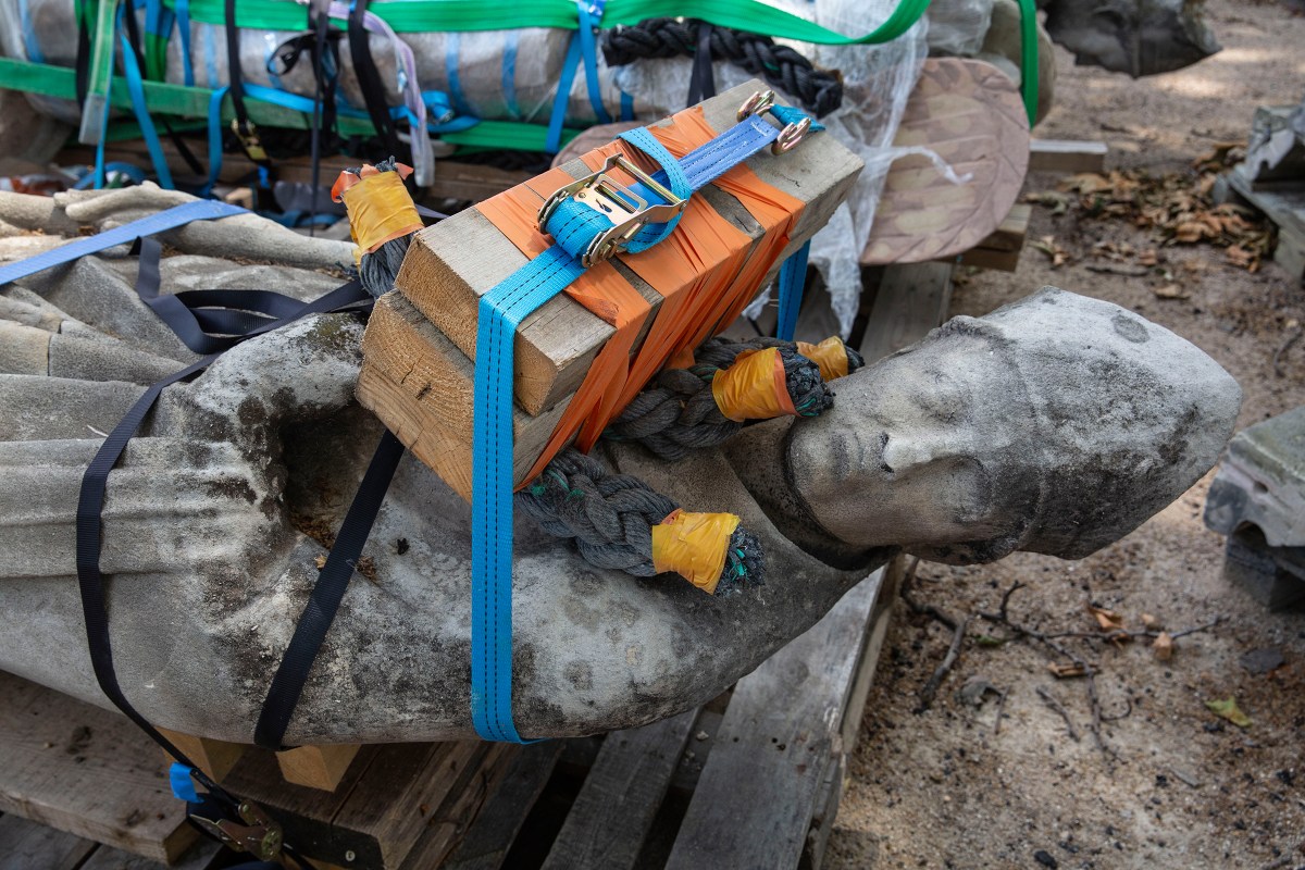 A damaged sculpture is prepared for transfer from the cathedral to a laboratory, where it will be analyzed and restored, on June 25.