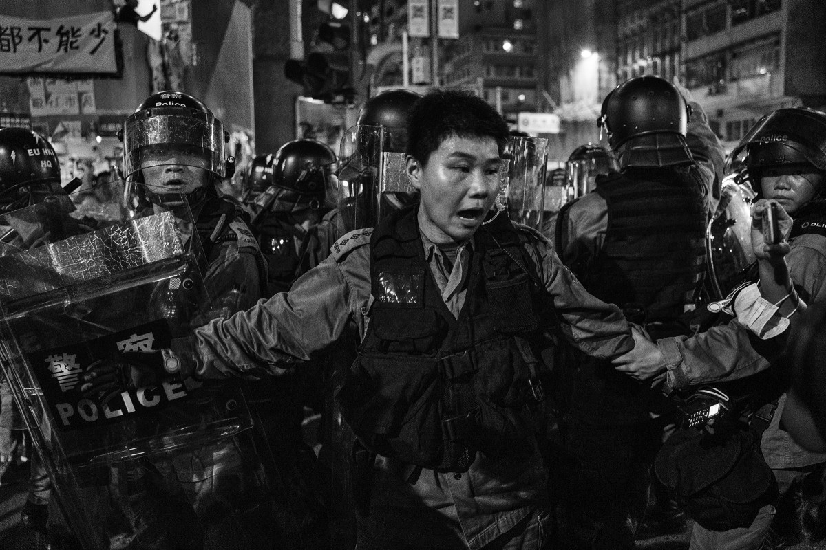 Police and local residents clash in the Sai Wan Ho area of Hong Kong on Aug. 12.