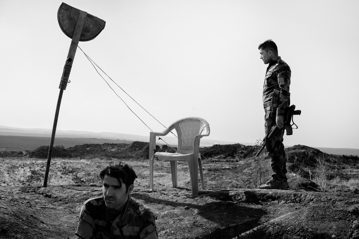 Kurdish fighters guard the new border between Kurdistan Regional Government-controlled territory and areas under the control of the Iraqi army near the town of Bashiqa, liberated from ISIS in 2016 by Iraqi and Kurdish forces.